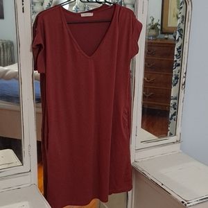 Medium, mauve, mid length dress, with side pockets